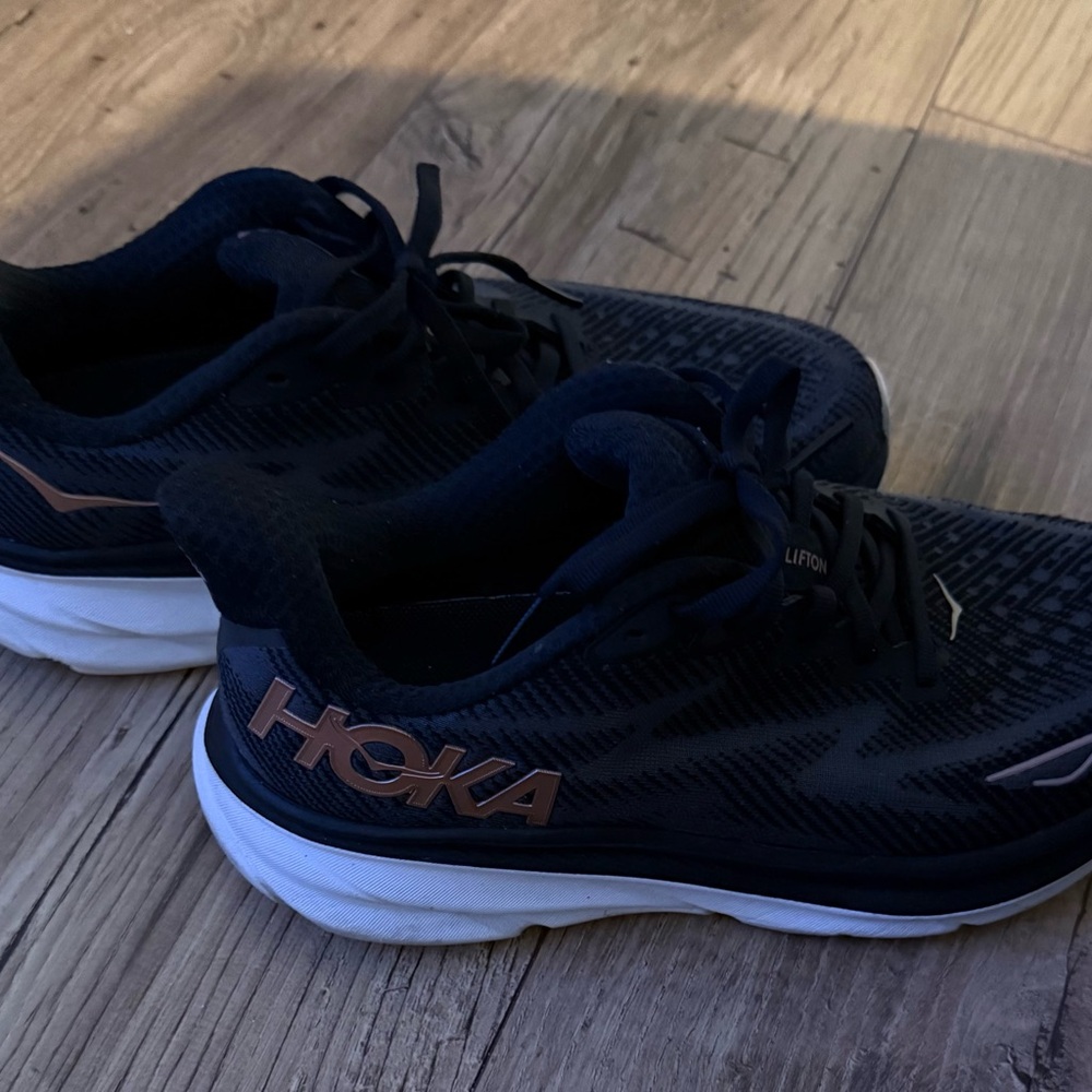 Hoka Women’s Black and Gold Athletic Shoes